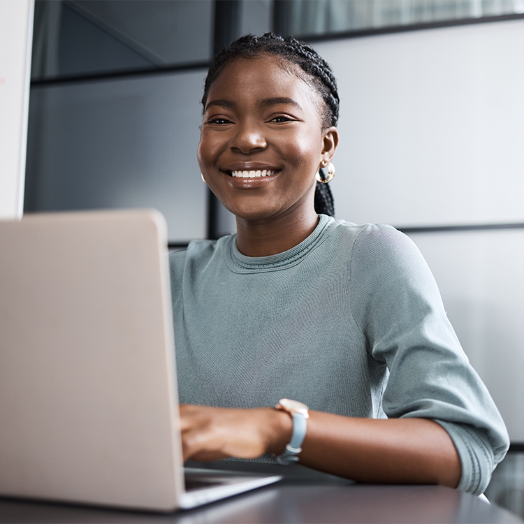 It takes determination, and I know it. Portrait of a young businesswoman working on a laptop in an office.